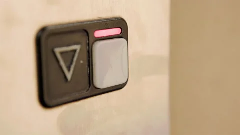 Close up detail of finger pressing elevator signal button to go down 4k Stock Footage 278380987