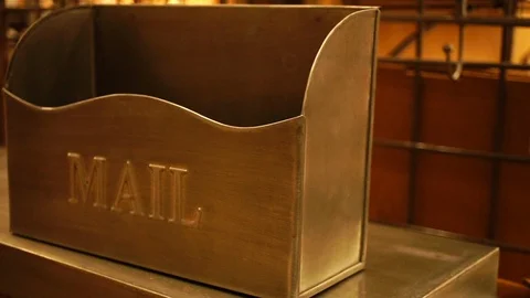 Close up detail pan of empty vertical metal mailbox in warm lighting Stock Footage 98847840