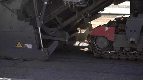Close up detail of a pavement milling machine used in road construction Stock Footage 152859699