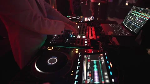 Close Up Detail of Professional DJ Hands Mixing Music on Controller and Laptop Stock Footage 334387956