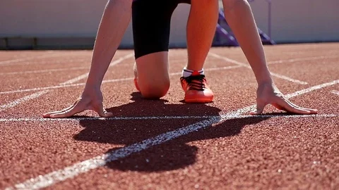 Close detail track runner boy teenager at starting line, slow motion Stock Footage 80659124