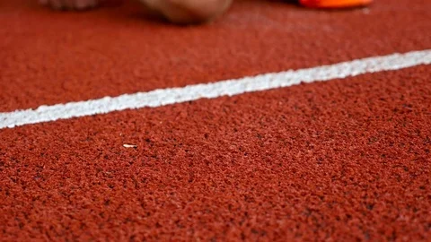Close detail of track runner putting hands at starting line Stock Footage 80605905