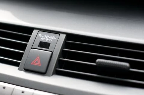 Close up detail of warning lights button and air vents inside a car Stock Photos