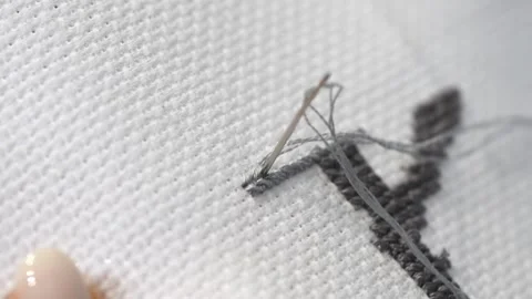 Close up detailed process of gray cross stitch embroidery creating textured.. Stock Footage 334955516