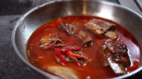Close up detailed view on chef cook hand adding salt and pepper in vegetable Stock Footage 106813492