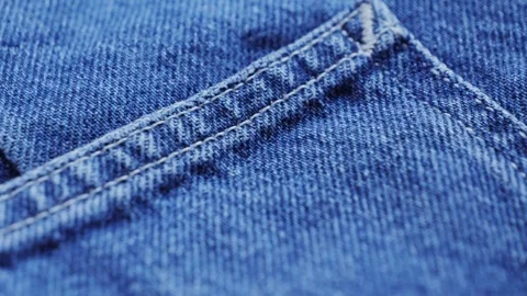 Close up of details and elements of jeans. Stitched seams. Texture of fabric Stock Footage 315573679