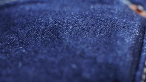 Close up of details and elements of jeans. Stitched seams. Texture of fabric Stock Footage 316215897