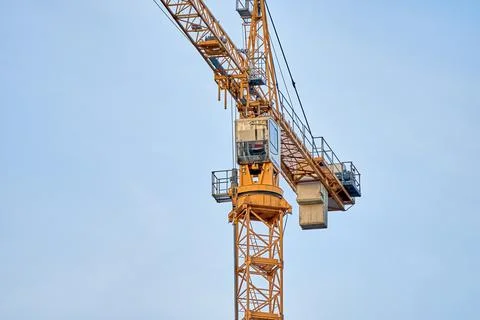 Close up details with a cabin control of a construction crane Stock Photos