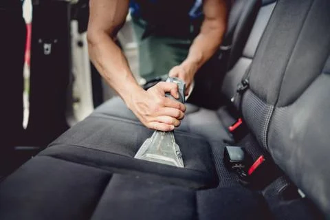 Close up details of car detailing - Cleaning and vacuuming car interior Stock Photos