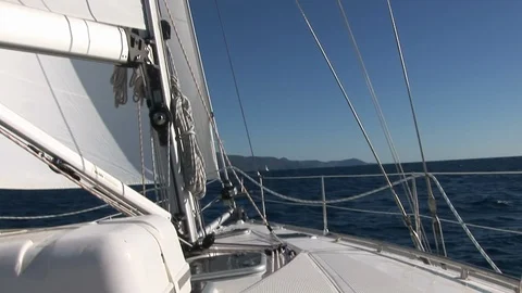 Close up details of deck and white sail of moving sailing yacht. 動画素材 118801564