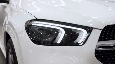 Close up of details of headlights of anonymous prestigious white luxury modern Video stock 164170713