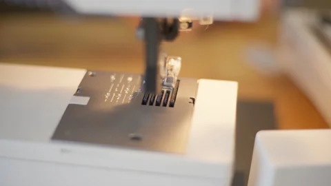 Close up details of sewing machine. Sewing machine foot Stock Footage 127977091