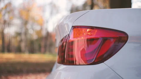 Close up of details of switched on tail lights of anonymous prestigious luxury Stock Footage 129304548