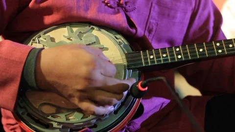 Close up details of a traditional stringed instrument being played in a band Stock Footage 100798815