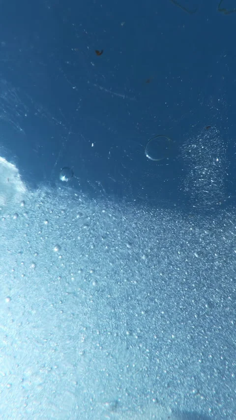 Close-up details of transparent, thin of ice with tiny frozen air bubbles Stock Footage 336000953