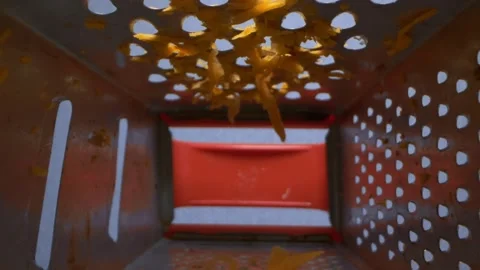 Close up, details. view inside an iron grater with grated carrots Stock Footage 138759783