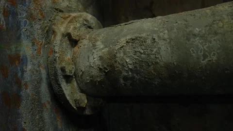 Close-up of deteriorated rusty pipes with peeling metal layers and bolts Stock Footage 295779605