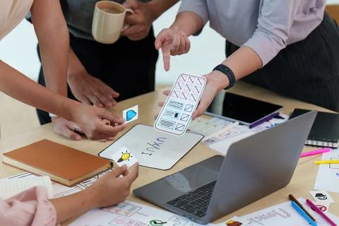 Close up of developer and ui designer brainstorming interface wireframe design 写真素材