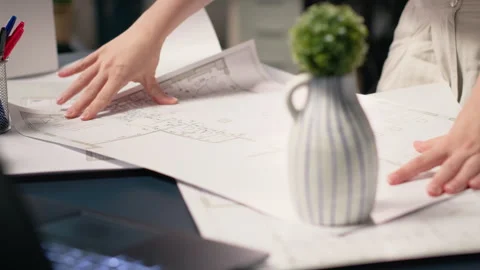 Close up of developer does city planning session with blueprints plan Stock Footage 316642318