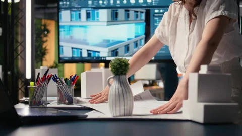 Close up of developer does city planning session with blueprints plan Stock Footage 316795052