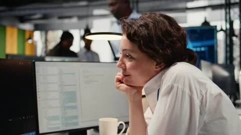 Close up of developer drinks coffee while working in AI startup 스톡 동영상 322703882