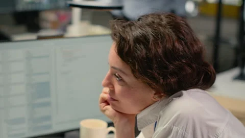 Close up of developer drinks coffee while working in AI startup Stock Footage 323238666