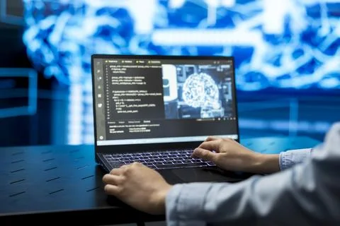 Close up of developer typing code on laptop keyboard, using machine learning Stock Photos