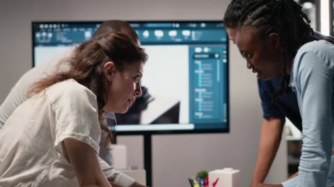 Close up of developers arranging 3D models to explore residential layout Stock Footage 316794267