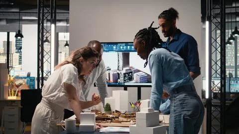 Close up of developers arranging 3D models to explore residential layout Stock Photos