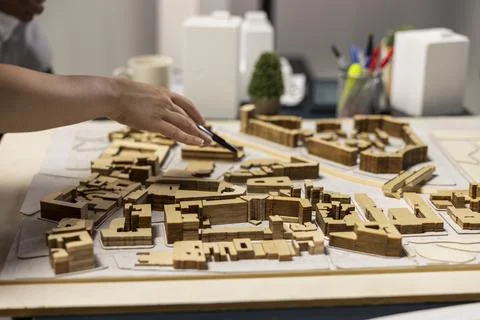 Close up of developers arranging 3D models to explore residential layout options Stock Photos