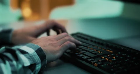 Close-up of a developer's hands working and writing code for a project Stock Footage 221910664