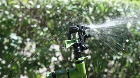 Close-up device for artificial watering of greenery or fields. Artificial Stock Footage 201326743