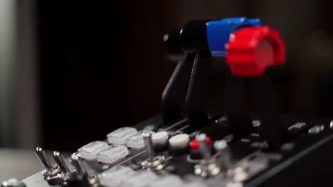 Close up device with buttons and twirls indoors Stock Footage 220877219