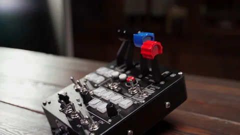 Close up device with buttons and twirls indoors Stock Footage 220877241