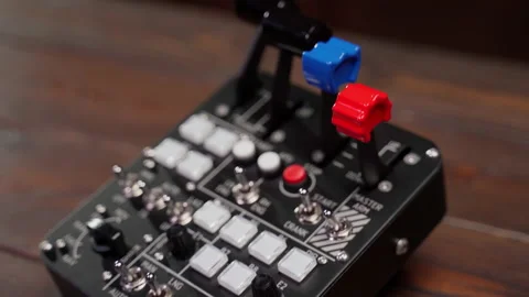 Close up device with buttons and twirls indoors Stock Footage 221168402