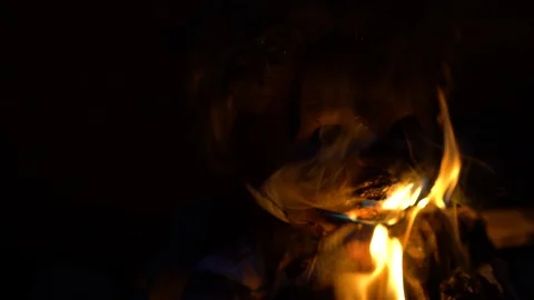 Close-up of devilish doll face burning on fire, occult ritual, black magic Stock Footage 118504120