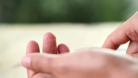 Close up diabetic test using lancet pen ad glucometer on finger with blood drop Stock Footage 156479605