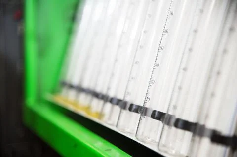 A close-up diagnostic stand with fuel flasks for checking the flow rate of the Stock Photos