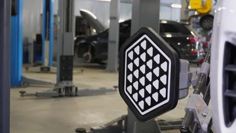 Close-up diagnostics and balancing of wheels on a lift at a service station. Stock Footage 337733835
