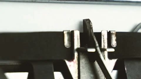 Close up diagonal view typing text " follow us " on a old typewriter Stock Footage 149347651