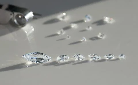Close up of diamonds in the evaluating process at expert workplace. Stock Photos