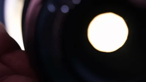 Close up of the diaphragm of a camera lens taking photos Stock Footage 128926082