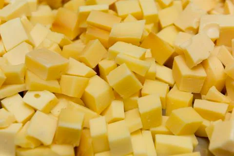 Close up of diced cheese to be served at party. Cheese seasoned with oregano, Stock Photos