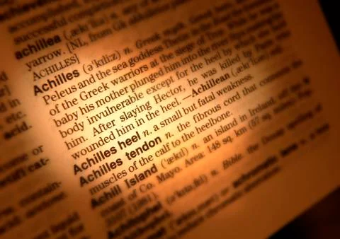 CLOSE UP OF DICTIONARY PAGE SHOWING DEFINITION OF THE WORD ACHILLES HEEL Stock Photos