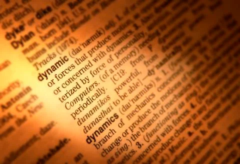 CLOSE UP OF DICTIONARY PAGE SHOWING DEFINITION OF THE WORD DYNAMIC Stock Photos