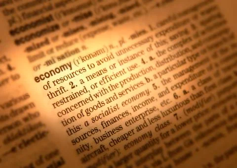 CLOSE UP OF DICTIONARY PAGE SHOWING DEFINITION OF THE WORD ECONOMY Stock Photos