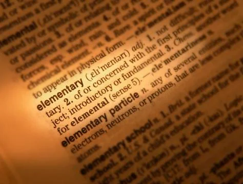 CLOSE UP OF DICTIONARY PAGE SHOWING DEFINITION OF THE WORD ELEMENTARY Stock Photos