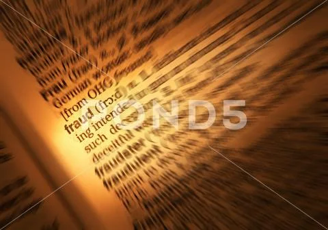 CLOSE UP OF DICTIONARY PAGE SHOWING DEFINITION OF THE WORD FRAUD Stock Photos