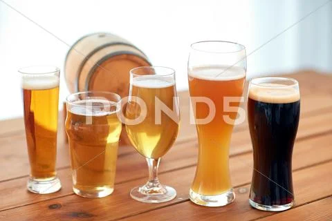 Close up of different beers in glasses on table Stock Photos