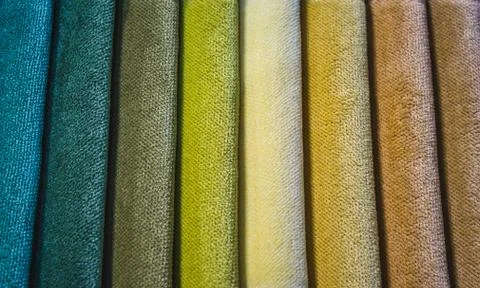Close-up of different colored swatch fabric samples in a vertical pattern Stock Photos